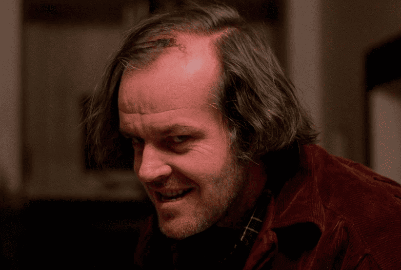 Jack Nicgolson como Jack Torrance no filme O Iluminado. Um dos personagens mais famosos dos anos 80.