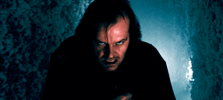 Jack Nicgolson como Jack Torrance no filme O Iluminado. Um dos personagens mais famosos dos anos 80. 