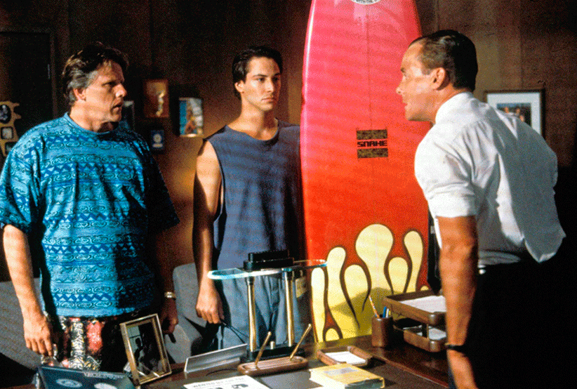 Gary Busey e Keanu Reeves em Caçadores de Emoção