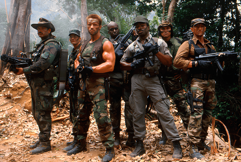 Da esquerda para direita: Jesse Ventura, Shane Black, Arnold Schwarzenegger, Bill Duke, Carl Weathers, Sonny Landham e Richard Chaves em O Predador (1987)