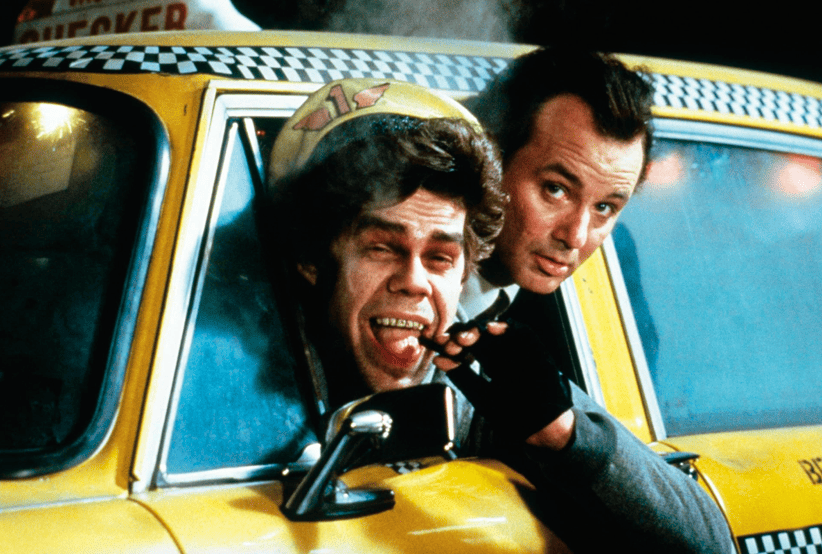 Frank Cross (Bill Murray) no filme Os fantasmas Contra Atacam (1988). Em uma lista dos melhores filmes de natal.