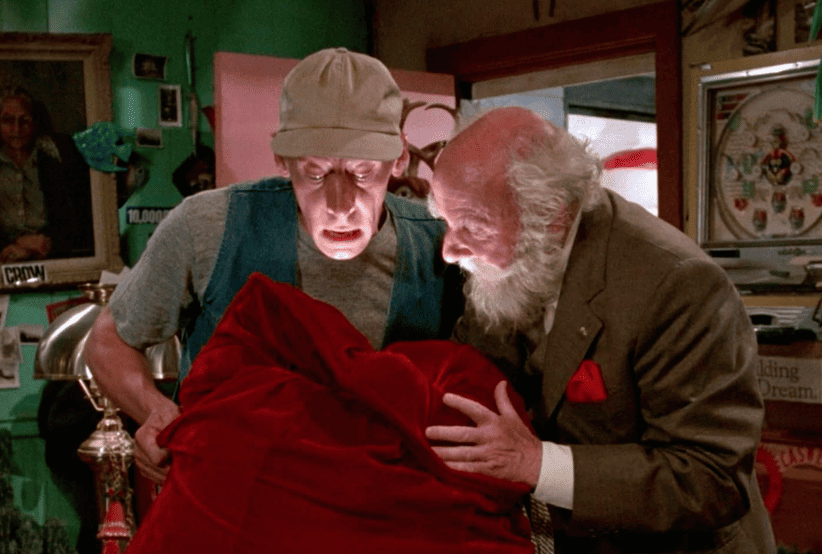 Ernest P. Worrell (Jim Varney) no filme O Natal Maluco de Ernest (1988). Em uma lista dos melhores filmes de natal.