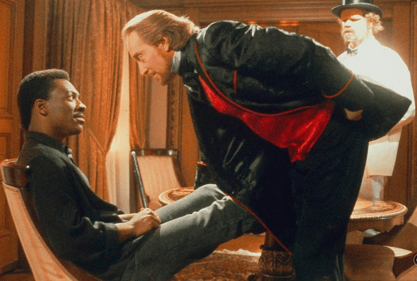 Eddie Murphy, Charles Dance e Randall 'Tex' Cobb em O Rapto do Menino Dourado (1986). Em uma lista que reúne os melhores filmes de Eddie Murphy