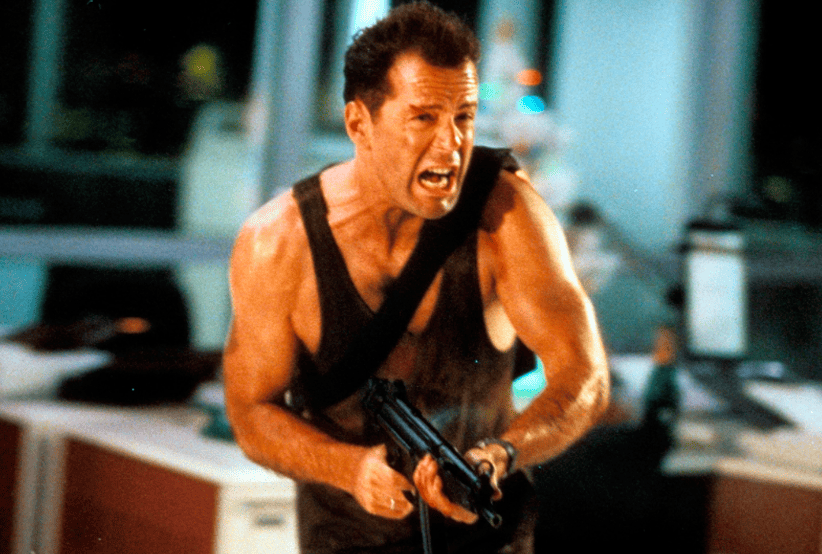 Bruce Willis como John McClane em Duro de Matar em 15 curiosidades sobre Duro De Matar (1988).