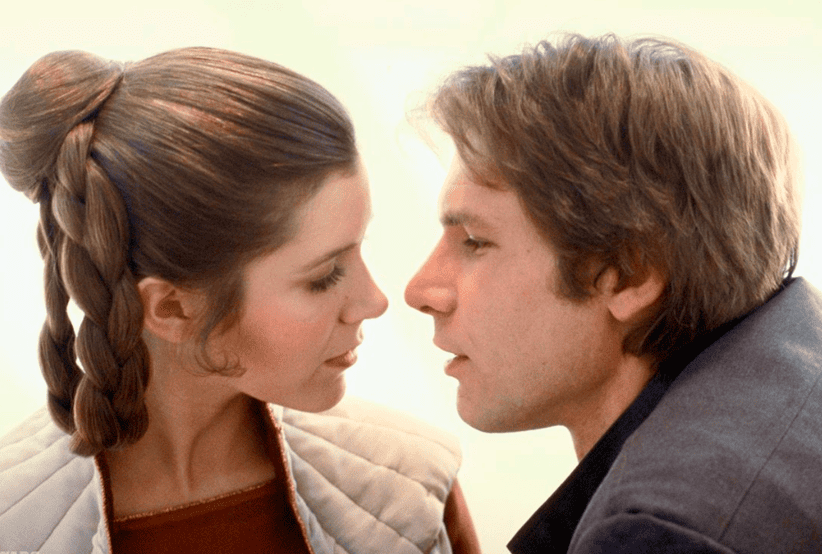 Casais do Cinema:  Atores: Harrison Ford e Carrie Fisher no Filme: Star Wars - Uma Nova Esperança (1977)